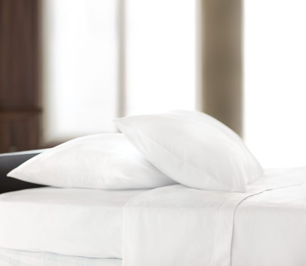 Centium Satin™ Sheets and pillowcases shown on a bed.