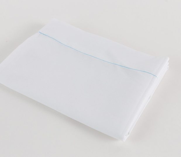 100% Polyester Hospital Sheets for hospitals and health systems. Woven polyester flat sheet folded and shown in Bleached White.