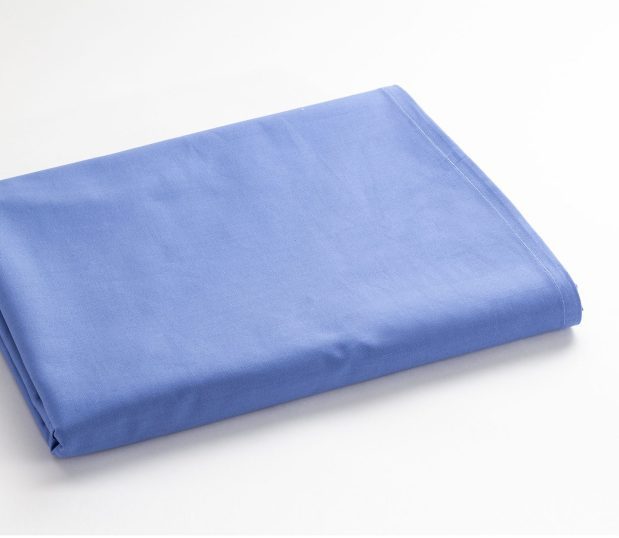 100% Cotton Vat-dyed Woven Flat Sheet for hospitals. Featured here folded and in the color Ceil Blue. Flat sheet size is 60x108.