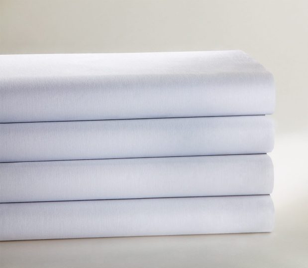 PerVal® Woven Sheeting for hospitals and health systems shown here stacked and folded.