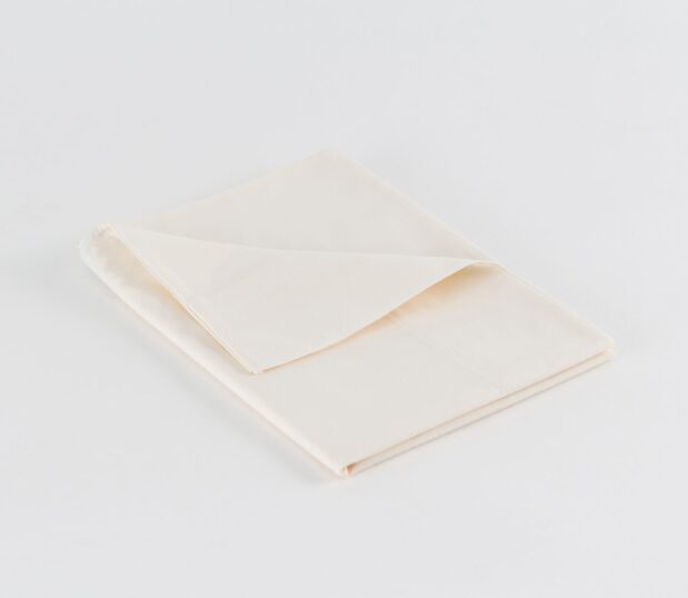 Bone Dyed Percale hospital pillowcase shown folded. Available in King and Standard sizes for hospitals and healthcare systems.