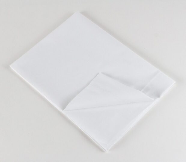 Standard Classic 7030 Woven Sheeting for hospitals and health systems. Available in flat sheet, pillowcase, or drawsheet. Folded flat sheet shown.