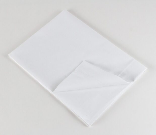 Standard Classic 7030 Woven Sheeting for hospitals and health systems. Available in flat sheet, pillowcase, or drawsheet. Folded flat sheet shown.