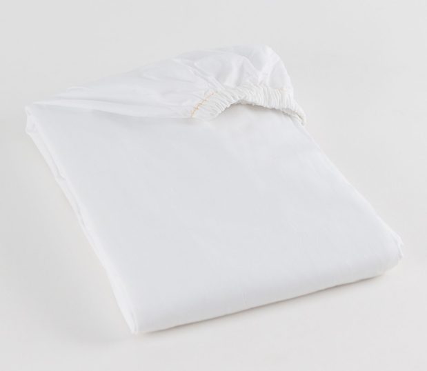T-180 Woven Sheeting for hospitals and health systems hospital bedding. Contour sheet shown folded in the color Bleached White.