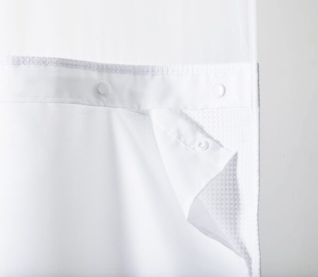 Detail of the snaps on the hookless shower curtain liner.