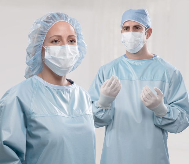 Two surgeons wearing the ProMax® Reusable Surgical Gowns. This sugical gown has a AAMI Level 4 Barrier Protection.