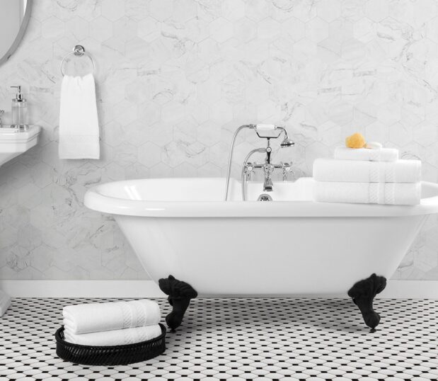 A favorite of a former US President, these luxury bath towels made in America will impress five-star guests and dignitaries alike. Image shows a bathroom setting with various capitol towels.