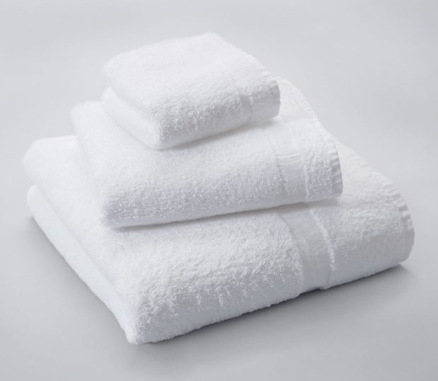 These hard-working Classic Cam Towels are a perfect choice for hotels who need a classic look, durable product, and an affordable cost per use. Shown here: a stack of a classic cam wash, hand and bath towel.