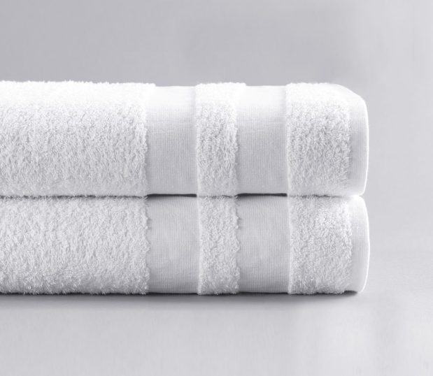 These Double Cam wholesale hospital bath towels feature a unique twist on the classic cam border design. Two white double cam borders are folded and stacked.