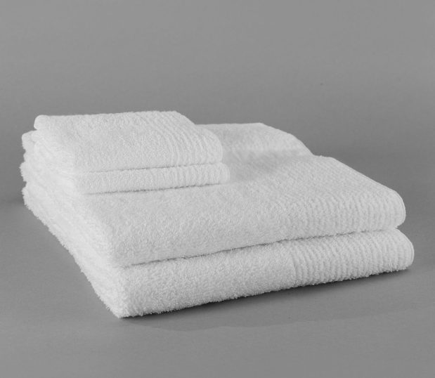 A stack of Double Duty bath and wash towels are shown in a stack of two each. This version features a ribbed edges.