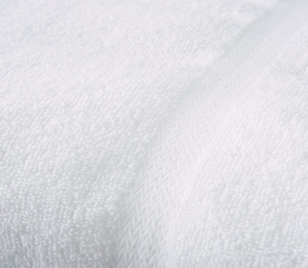 Detail of the EuroTouch Towel showing the decorative dobby border. These durable cotton towels are also velvety soft.