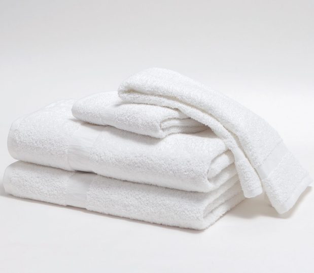 A stack of Standard Express Towels. Picutred are two bath towels, and a bath and wash towel. These are bulk towels available at an affordable price.