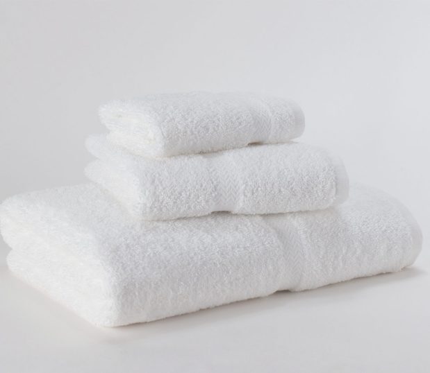 This is an image of the Standard Express towels with a decorative dobby border. Featured in the photo are one each of the bath, hand and wash towels. These bulk towels are designed for the budget conscious property.