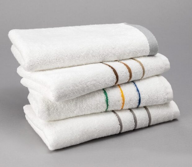 A colorful stack of striped bulk gym towels.