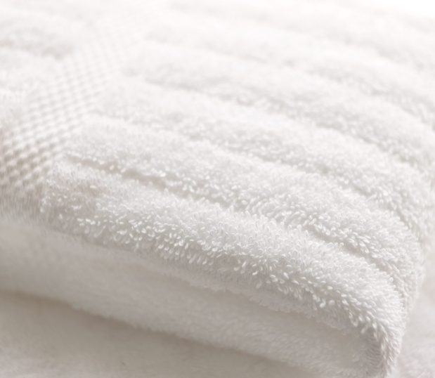 Luxury stripe towel detail showing it's plush thickness.