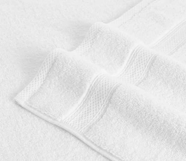 Lynova® uses luxurious, low twist microcotton to create the softest towels in hospitality. Perfect for properties who spare no expense for an elegant experience. Shown here: a detail shot of the decorative border of a Lynova towel.