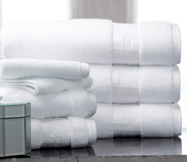 Designed by Todd-Avery Lenahan, The Braque Towel Collection, is shown here in two stacks, with two each bath, hand and wash towels. These elegant towels feature rich geometric textures.
