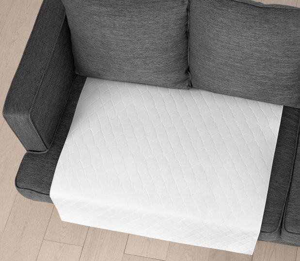 Our TruVal® Underpads are made from 100% synthetic materials, giving them superior durability. Laminated construction extends service life even further. A true value for hospitals and health systems! Shown here: the underpad on a couch.
