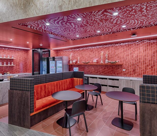 Breakfast area with red custom wallcovering.