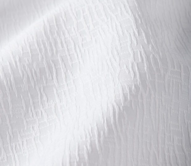 Detail of the white top cover Impressions in the textural Crackle pattern.