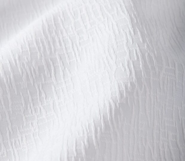 Detail of the white top cover Impressions in the textural Crackle pattern.