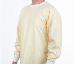 Image of the front of a yellow ComPel® Reusable Isolation Gown.