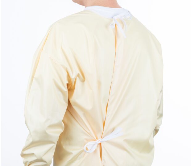 Image of the back of a yellow ComPel® Reusable Isolation Gown showing the tie closures.