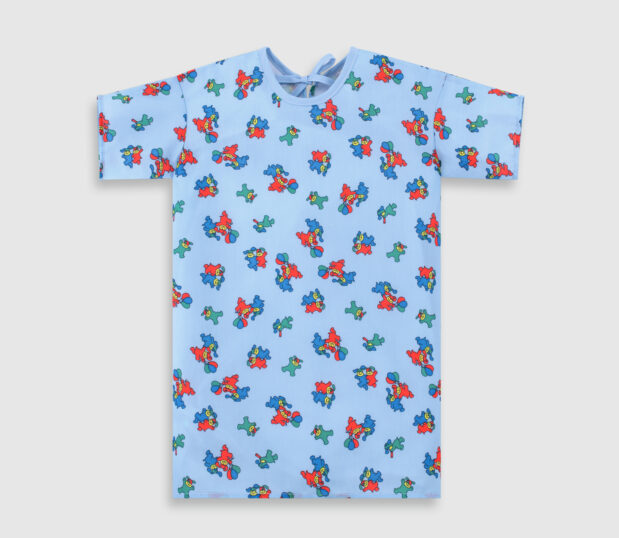 By ChildGuard, this Toddlers Patient Gown is shown in the Blue Happy Hound Print. It is 100% Polyester and features the Center Back Style.