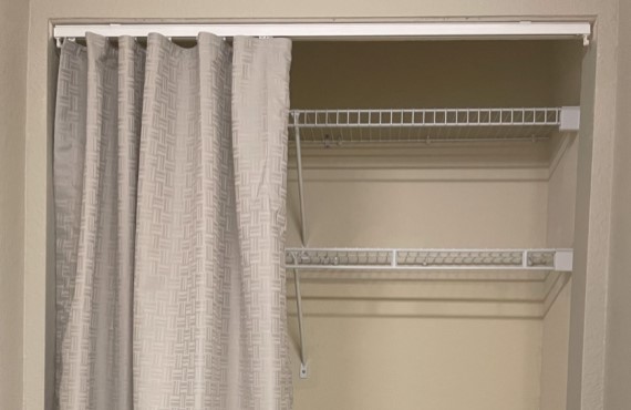 Bezel fabric used as drapery for closet applications.