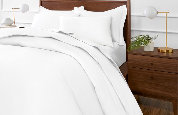 Paragon™ Cotton Duvet set in white on bed